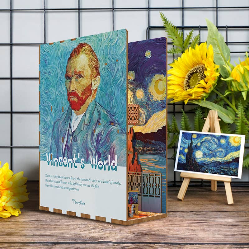 The DIY Book Nook Kit: Vincent's World by Hands Craft features a decorative Van Gogh bookshelf insert with his portrait and "Vincent's World" text, sunflowers, an easel with "Starry Night," all set against a grid-patterned wall.
