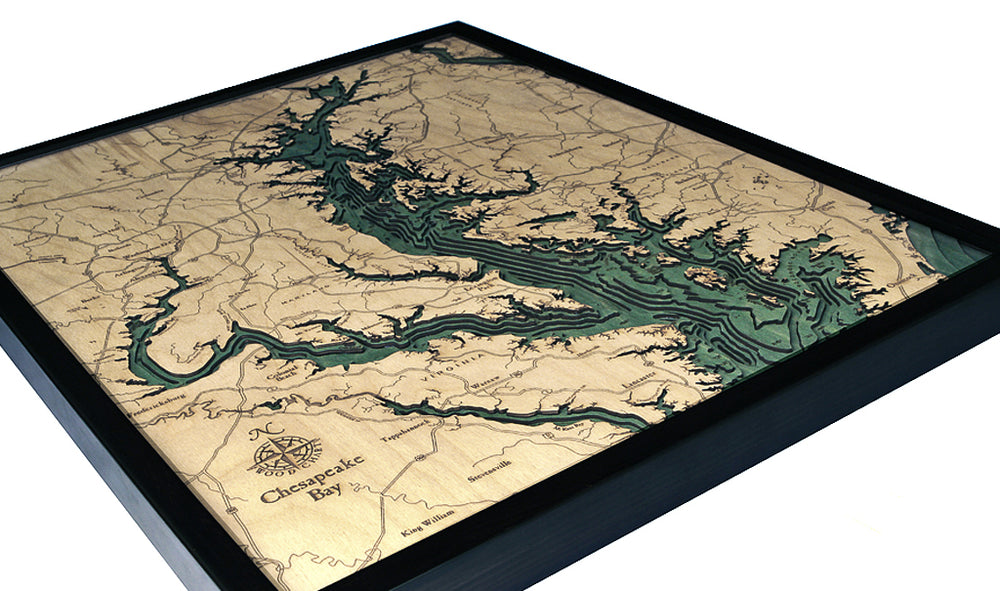 The WoodChart Chesapeake Bay 24.5" x 31" Black Frame is a laser-cut wooden map featuring layered blue and natural wood contours that highlight the bay’s depth and shoreline details.