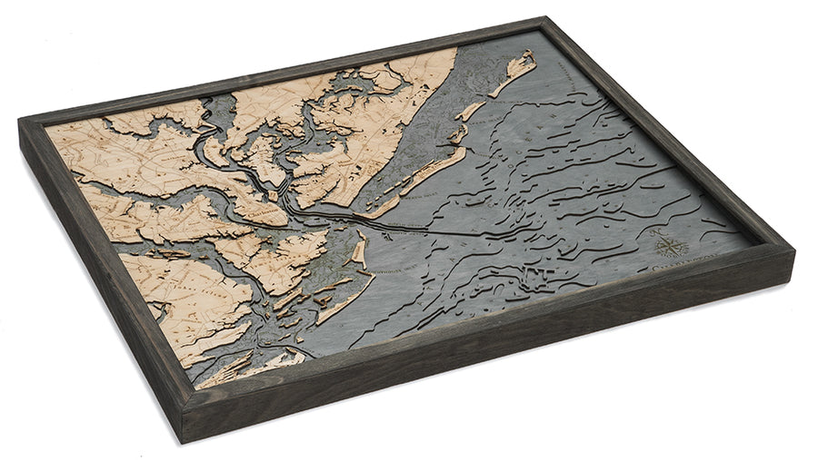 The WoodChart CharlstonSC 24.5 x 31 Grey Frame is a layered wooden map with engraved land and water details in natural wood and gray tones, showcasing coastal geography and topography in a stylish framed design.