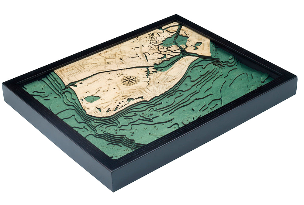 The WoodChart Cape May NJ 16" x 20" Black Frame features a layered wood map with engraved details and varying land and water elevations in beige and green, creating a nautical-style depiction of Cape May and its surrounding waters.