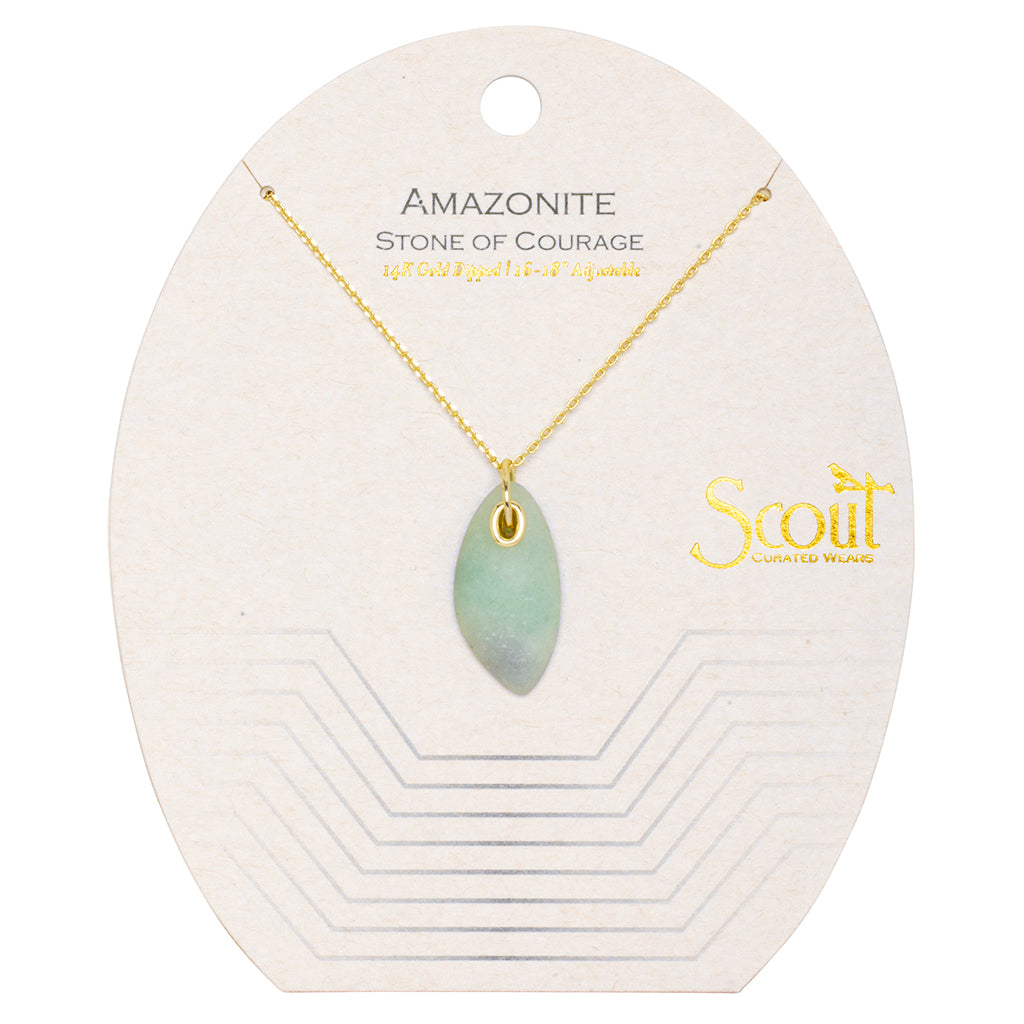 The Amazonite Gold Organic Stone Necklace features a light green amazonite stone pendant hanging on a 14k gold chain. The packaging is labeled with "AMAZONITE, STONE OF COURAGE" and "18KT Gold Dipped, 16\" + 18\" adjustable," along with the brand name "Scout Jewelry" on the right side.