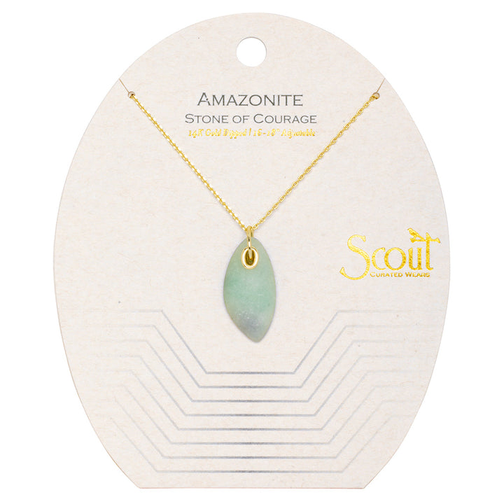 The Amazonite Gold Organic Stone Necklace features a light green amazonite stone pendant hanging on a 14k gold chain. The packaging is labeled with "AMAZONITE, STONE OF COURAGE" and "18KT Gold Dipped, 16\" + 18\" adjustable," along with the brand name "Scout Jewelry" on the right side.