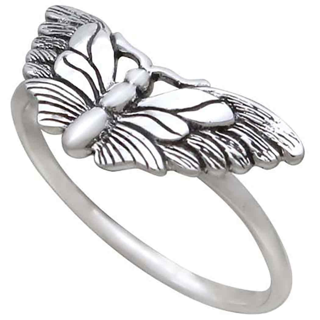 Introducing the s9 Winged Butterfly Ring by Nina Designs: a sterling silver moth ring adorned with an intricately designed butterfly featuring detailed wings, crafted to evoke a sense of intuition. Its slender band accentuates the butterfly as the focal decorative piece, enhancing your psychic awareness.