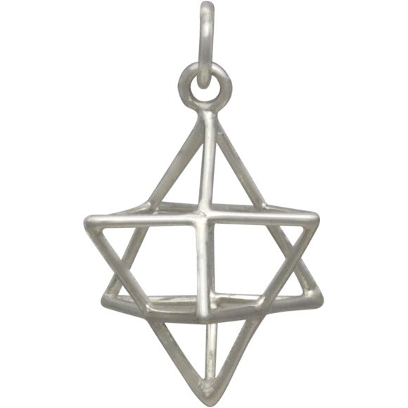 The Sterling Silver Wire Merkaba Pendant by Nina Designs features a three-dimensional geometric star design, suspended from a simple loop—a striking piece of geometric jewelry.