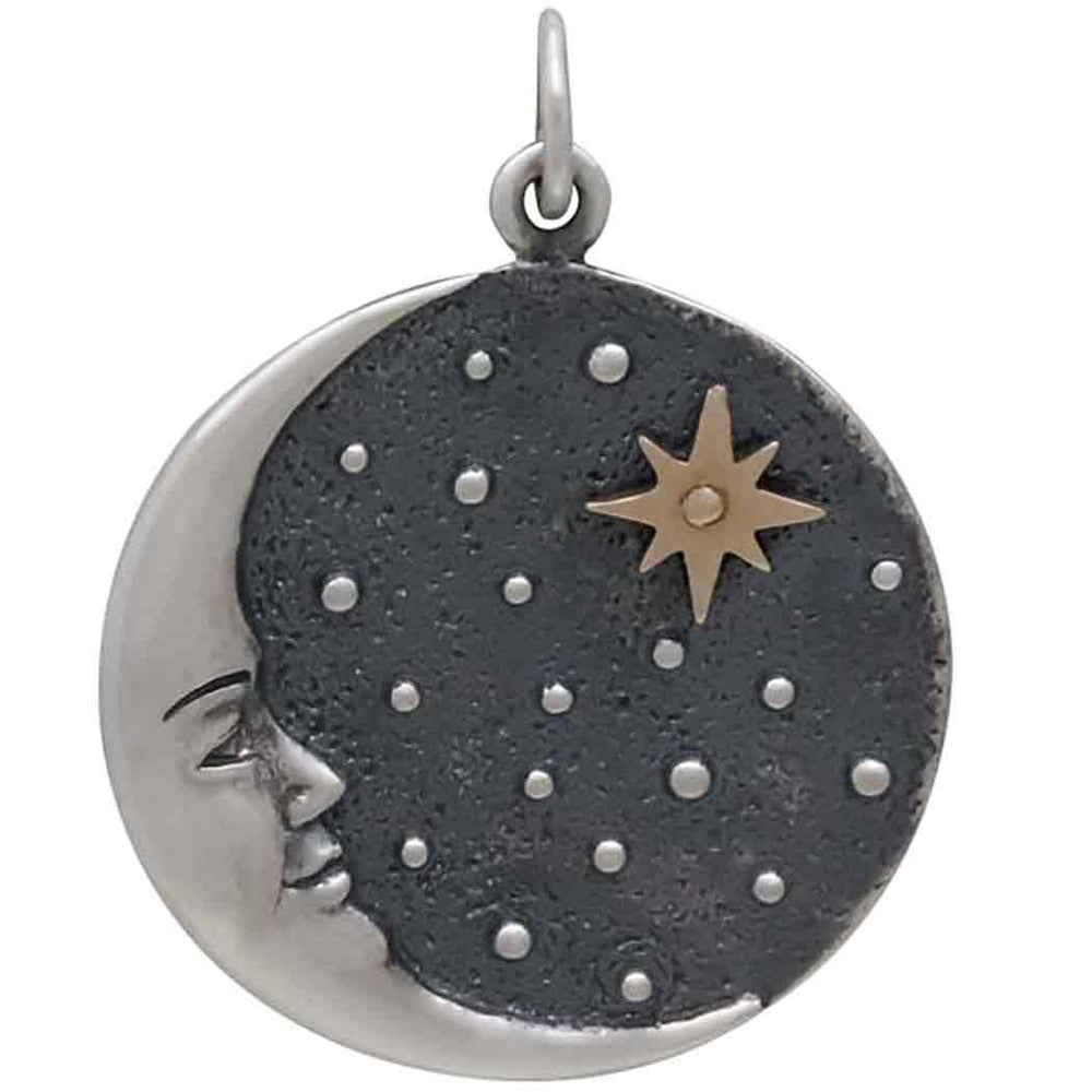 The Nina Designs Silver Crescent Moon Face Pendant features a round sterling silver design with a crescent moon face on the left side, complemented by a dark, textured backdrop adorned with small stars and a prominent bronze star at the top.