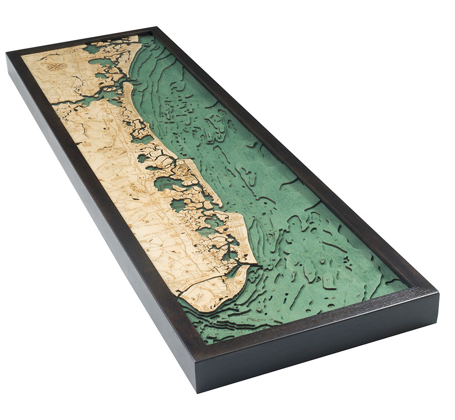 The WoodChart NJ South Shore 13.5" x 43" Black Frame is a rectangular, framed layered wood map featuring beige land, green-blue water, and detailed cutouts of coastline contours and ocean depths.