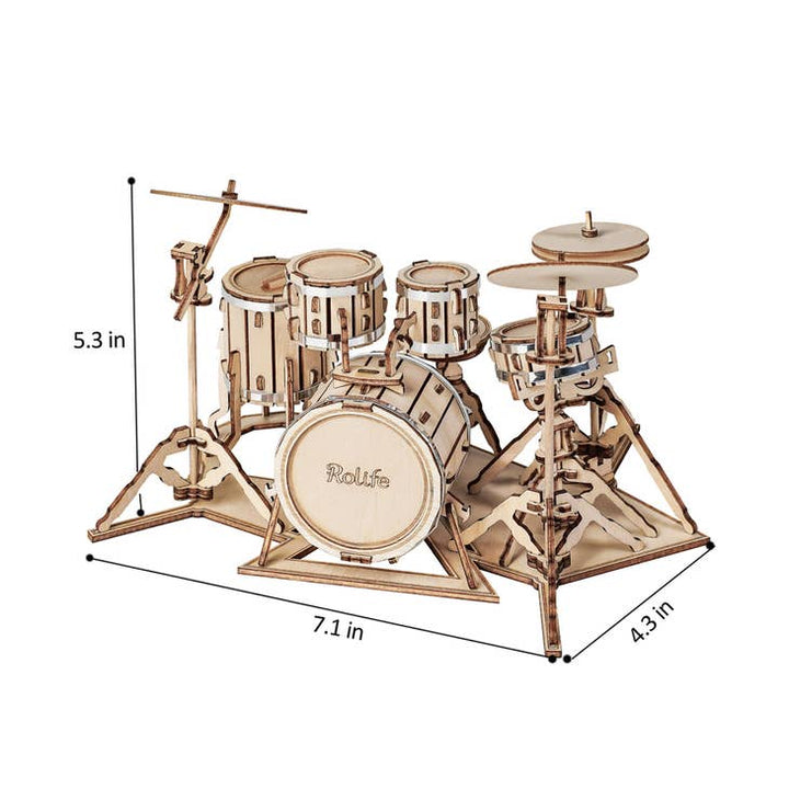 The Hands Craft Laser Cut Wooden Puzzle: Drum Kit is a beautifully detailed model drum kit, featuring components such as a bass drum, snare drums, toms, a hi-hat, and cymbals. Perfect for enthusiasts as a 3D puzzle or as a unique home decoration. The dimensions of this kit are 7.1 inches wide, 4.3 inches deep, and 5.3 inches tall.
