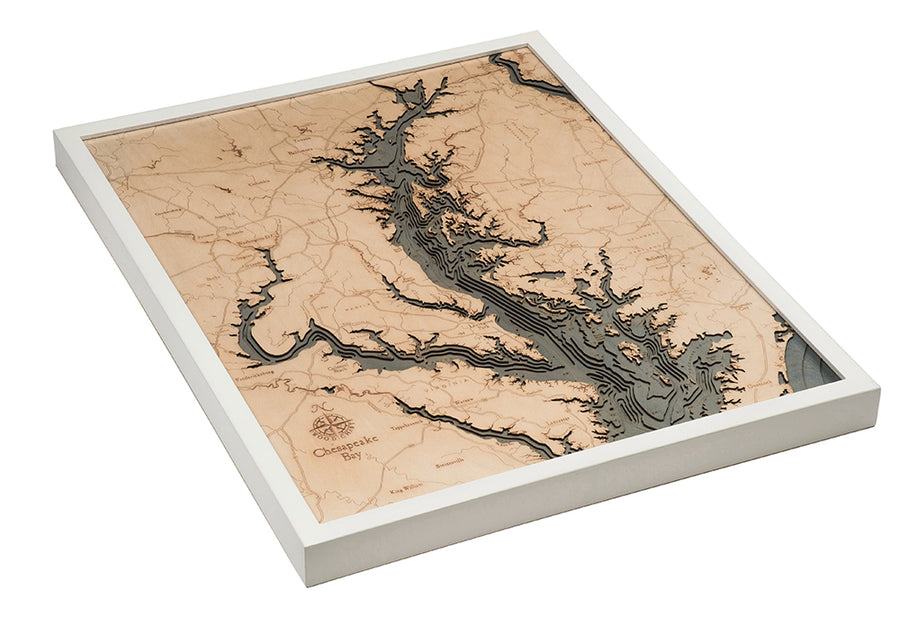 The WoodChart Chesapeake Bay 24.5" x 31" map features layered, engraved wood in a white frame, detailing land and water with “Chesapeake Bay” labeled in the lower left corner.