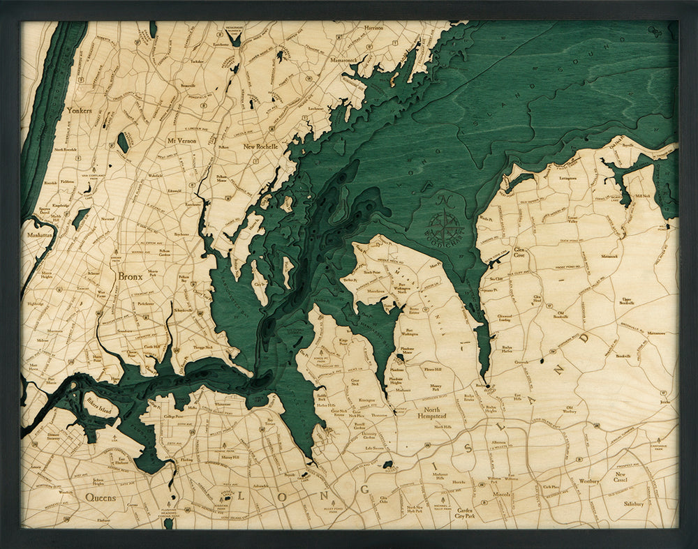 The WoodChart West Long Island 24.5" x 31" Black Frame is a wooden map with carved details of West Long Island and nearby areas, featuring raised green bodies of water, lighter wood land, and labeled towns, neighborhoods, and roads.
