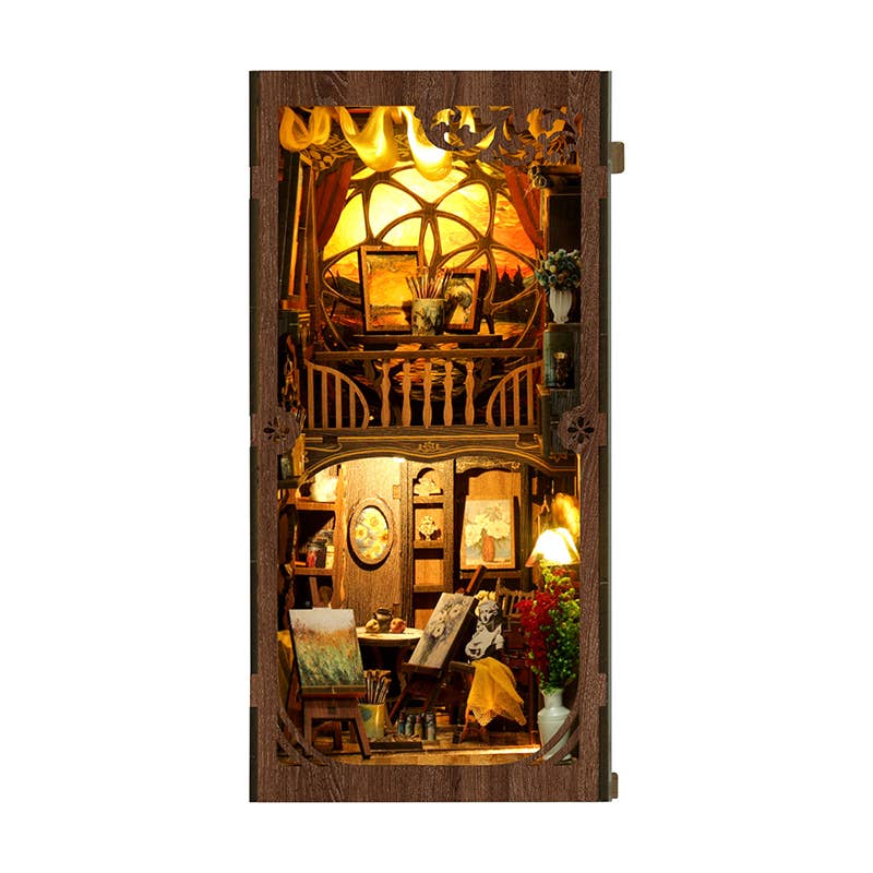 Hands Craft DIY Book Nook Kit: Golden Twilight Studio—a two-story artist’s loft bookshelf insert with an art studio, cozy loft, circular window, touch-activated LED lights, warm yellow glow, and a charming wooden frame.