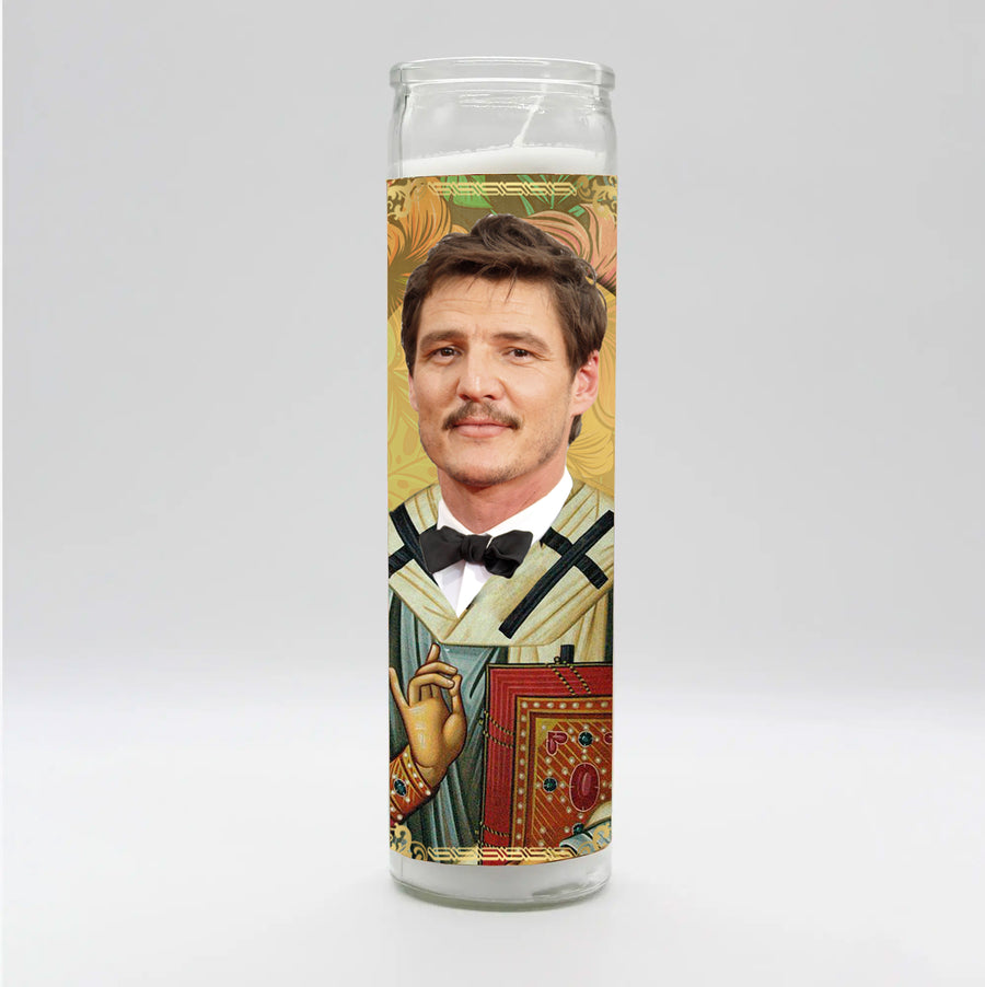 The Pedro Pascal Candle by BOBBYK BOUTIQUE is a decorative, hand-poured piece showcasing a man in a formal suit with a bow tie, surrounded by artistic patterns. This unscented candle features an ornate background with intricate designs, set against a plain, light-colored backdrop.