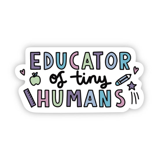 The "Educator of Tiny Humans" sticker by Big Moods is a colorful vinyl design featuring the phrase in bold letters. Surrounding the text are charming illustrations of a green apple, a pencil, a ruler, hearts, and a shooting star. This waterproof and whimsical sticker is perfect for teachers.