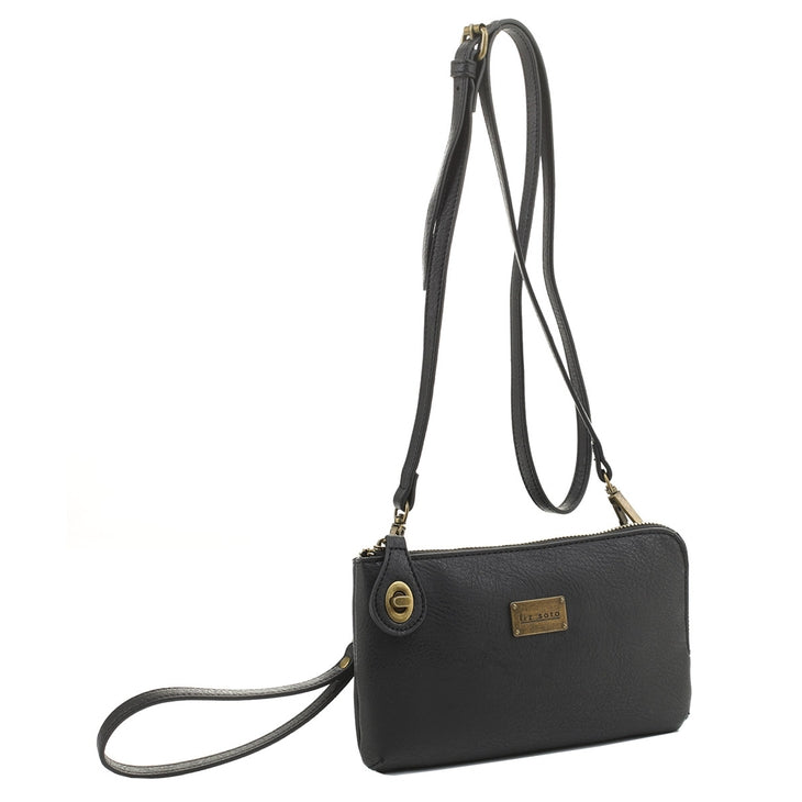 The Tina Cell Bag - Black by Liz Soto Handbags is displayed against a white background. This versatile wristlet-style handbag showcases a gold-tone logo plaque, a small zip pocket, and a long adjustable strap suitable for crossbody or shoulder carrying.