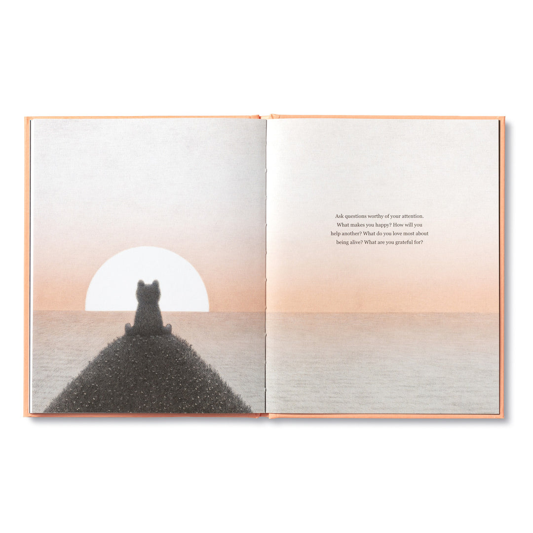 The pages of "Feeling Grateful" by Compendium reveal an illustration on the left depicting a small character sitting on a hill, gazing at a serene sunset over the sea. The right page bears text prompting reflective questions about gratitude and self-improvement in a simple, elegant font. The color scheme is soft and calming, creating a peaceful ambiance for young readers.