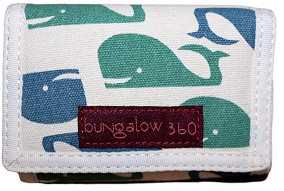 The Tri Fold Wallet Whale, designed by Bungalow 360, is made from durable cotton canvas and features a charming whale pattern in green and blue tones against a light fabric. It includes a distinctive dark red label that reads "bungalow 360" stitched onto it, highlighting its unique design.