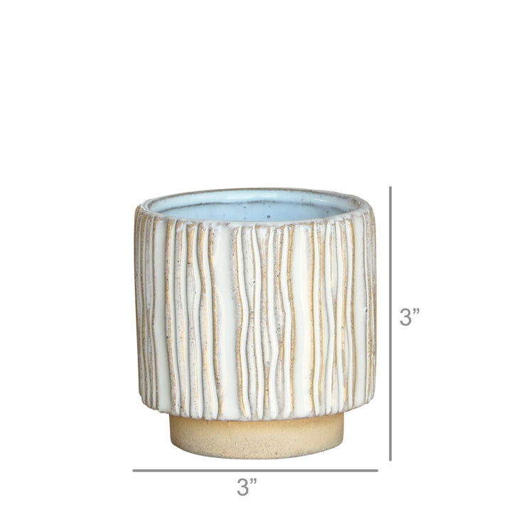 Introducing the Vertical Stripe Cachepot by HomArt: a petite, cylindrical ceramic planter featuring a hand-sculpted ribbed exterior in off-white and beige tones. The interior is beautifully glazed in light blue, making it ideal for indoor gardening. This stoneware beauty measures 3 inches in both height and diameter.