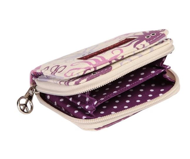 The Bungalow 360 Bill Fold Wallet Octopus is a compact wallet made from vegan cotton canvas, adorned with a distinctive octopus print design. It boasts a zipper closure complete with a peace sign charm and offers multiple compartments within its purple and white polka dot interior.