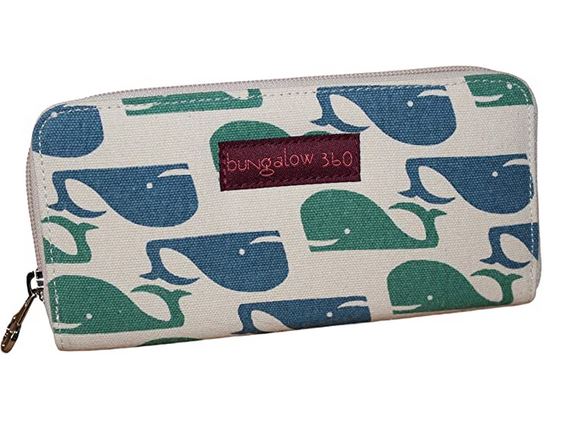 This vegan wallet, named the Zipper Wallet Whale and crafted by Bungalow 360, features a distinctive design with blue and green whales against a beige background, highlighted with a maroon label that reads "Bungalow 360.