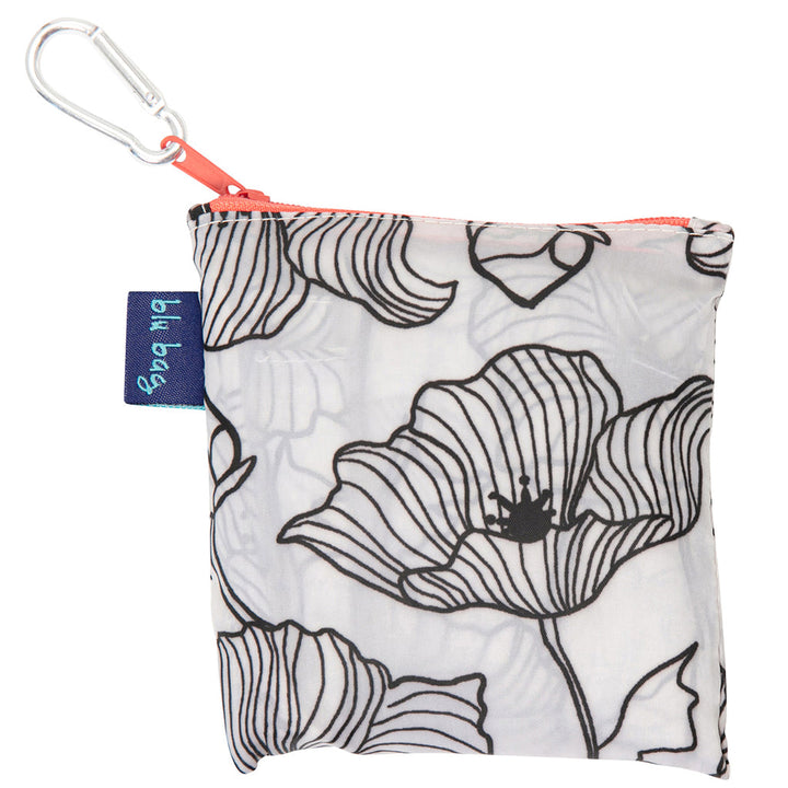 Introducing the Poppy Reusable Bag by zzzRockFlowerPaper: a compact pouch with a zipper and carabiner, adorned with a stylish black and white floral line drawing. This bag is ideal for carrying essentials and includes an environmentally friendly branded tag on the side.