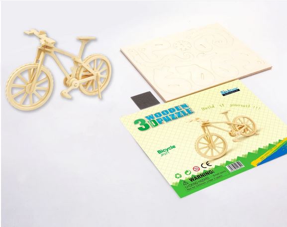 The DIY Bicycle 3D Wooden Puzzle by Hands Craft is a fantastic gift idea, featuring wooden pieces organized on a sheet for easy assembly into a model bicycle. The packaging, clearly labeled "DIY Bicycle 3D Wooden Puzzle," includes a vivid illustration of the bicycle along with a recycling symbol and requires no tools or glue for assembly.