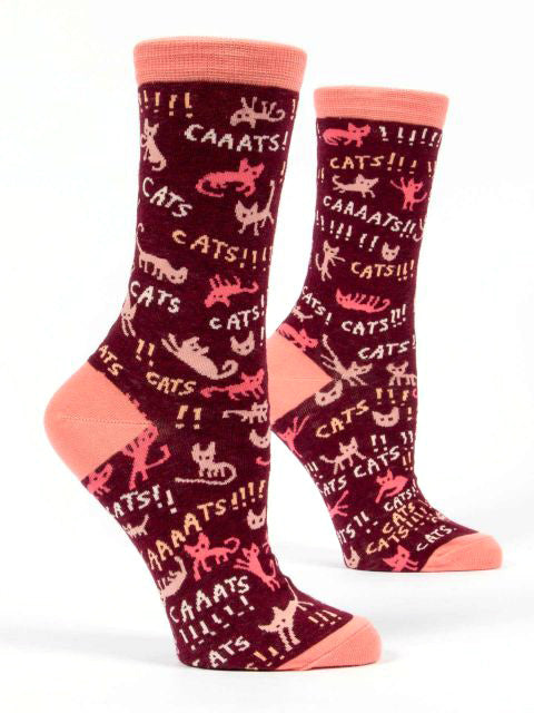 Introducing the Cats Cats cats Socks by Blue Q: a pair of high-quality combed cotton socks in maroon and pink, adorned with playful cat illustrations and various text exclamations like "CATS!" and "CAAATS!" in multiple fonts and sizes. Designed to fit women’s shoe sizes 5-10, these socks feature pink toes, heels, and cuffs—an ideal choice for any Cat Lover.