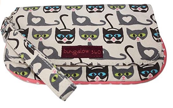 The Large Wristlet Cat Print by Bungalow 360 is a vegan accessory crafted from natural cotton canvas, featuring an adorable pattern of cartoon cats in black and grey with green and blue eyes, each decorated with a heart on their chest. It includes an attached strap for convenience, and the brand name "Bungalow 360" is prominently displayed on a small maroon patch on the front, highlighting its unique design.