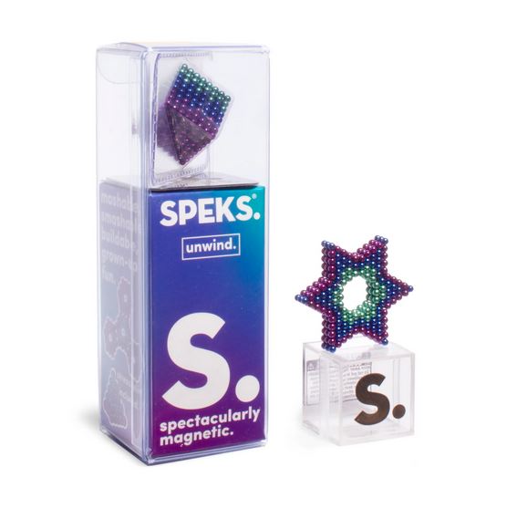 A package of the "512 Gradient Unwind Speks" by SPEKS is shown. The box features the label "S. spectacularly magnetic" and "unwind." Next to the box is a star-shaped figure made of colorful magnetic beads, displayed on a clear cube with the letter "S" on it—perfect for stress relief as a fidget toy.