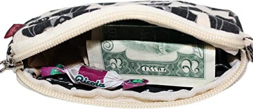 A partially open Tiny Wristlet Bat from Bungalow 360 reveals a folded U.S. dollar bill and a wrapped Ricola cough drop inside. The pouch, made from durable cotton canvas, showcases unique black and white patterns on its exterior.