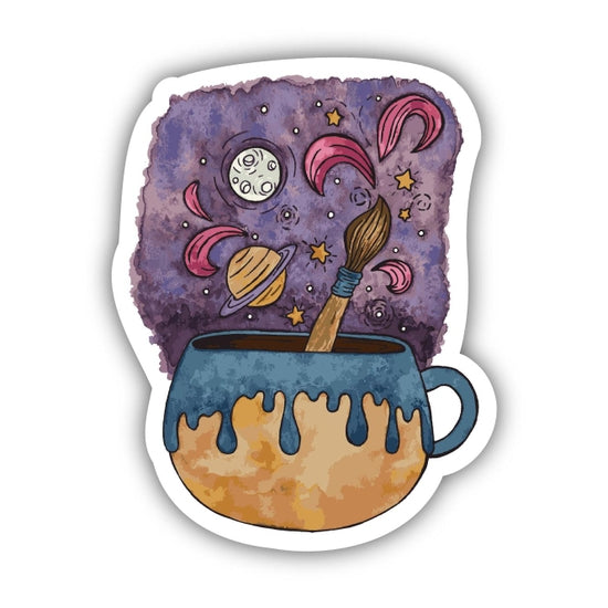 Introducing the Mug Artist Coffee Sticker by Big Moods: a robust vinyl sticker showcasing a celestial display of stars, planets, and swirling patterns. A paintbrush extends from the mug, symbolizing the fusion of creativity and imagination with the cosmic expanse.