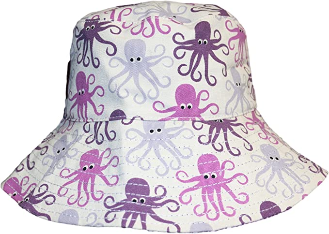 The Beach Hat Octopus by Bungalow 360 is a white bucket hat adorned with a distinct pattern of purple and pink cartoon octopuses, each sporting a cheerful smile. This reversible beach hat is both charming and packable, making it an ideal choice for your upcoming seaside adventure.