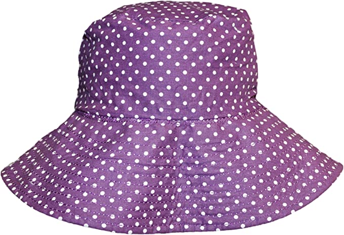 The Beach Hat Octopus by Bungalow 360 is a purple wide-brimmed hat adorned with white polka dots, making it a distinctive and packable travel accessory for any adventure.