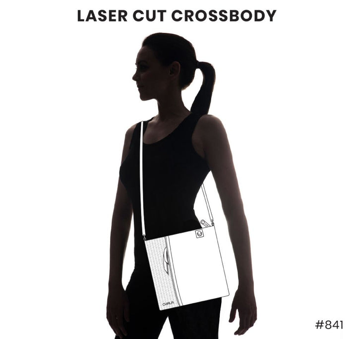 Silhouette of a person in a ponytail wearing a crossbody bag. The Chala Lasercut Crossbody DF in plum, crafted from faux leather, is illustrated with visible outlines and details that highlight its laser-cut pattern design. Text at the top reads "Lasercut Crossbody DF Plum," and at the bottom is "#841.