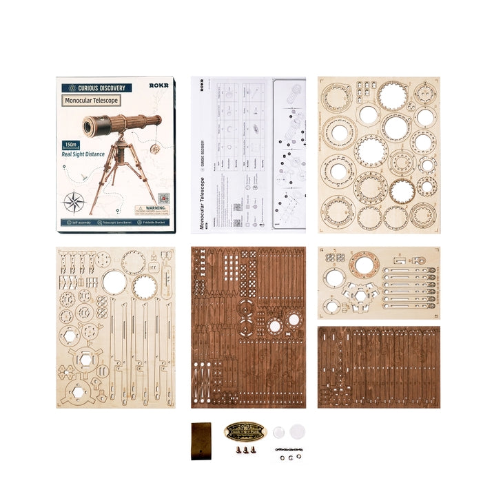 The DIY Wooden Puzzle: Monocular Telescope by Hands Craft is displayed, showcasing a pirate-themed setup. It includes an instruction booklet, a sheet of diagrams, assembly parts organized on separate boards, screws, small tools, and other components. Each board contains various wooden pieces with intricate cut-outs for the extendable telescopic lens.