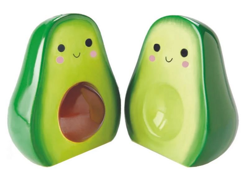 Introducing the Avocado Salt and Pepper set by Streamline: a delightful ceramic dolomite pair featuring charming faces and rosy cheeks. One shaker contains a seed, while the other remains empty, perfectly capturing the essence of avocado halves. With their smooth, glossy surfaces, they're an adorable addition to any table setting.