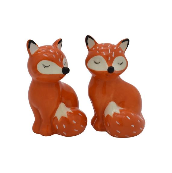 The Fox Salt and Pepper set from Streamline features two elegant porcelain fox figurines with orange bodies and white accents on their ears and tails. These serene foxes, sitting side by side with closed eyes, exude a peaceful demeanor against a plain white background.