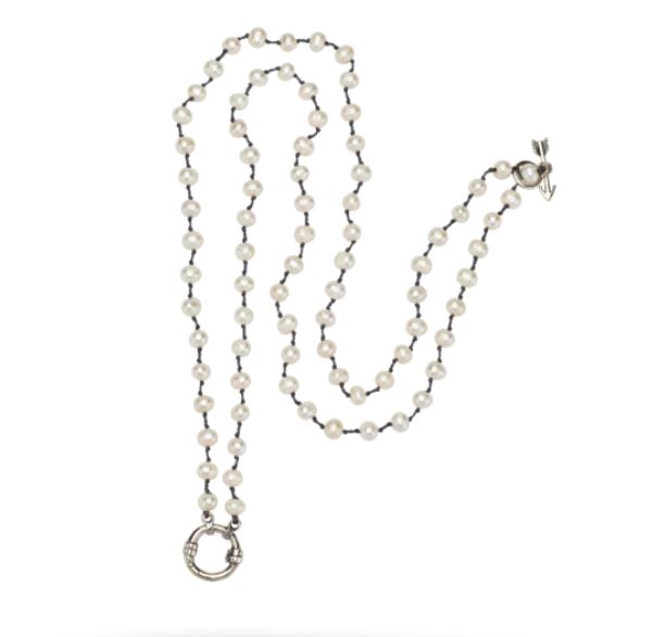 The Boho Soul Necklace by Waxing Poetic, measuring 36 inches, showcases a striking arrangement of evenly spaced freshwater pearls and a sterling silver clasp elegantly designed in a wavy pattern on a white background.