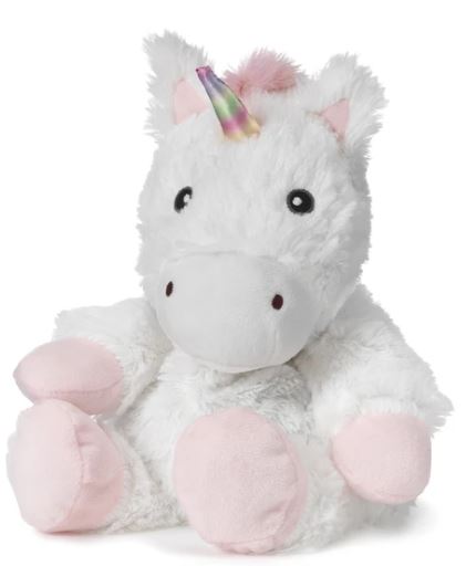 The White Unicorn Junior Warmie by Warmies features a fluffy white body, rainbow horn, pink ears and feet, and is infused with French Lavender for soothing comfort. Its cuddly embrace warms hearts effortlessly against any plain white background.