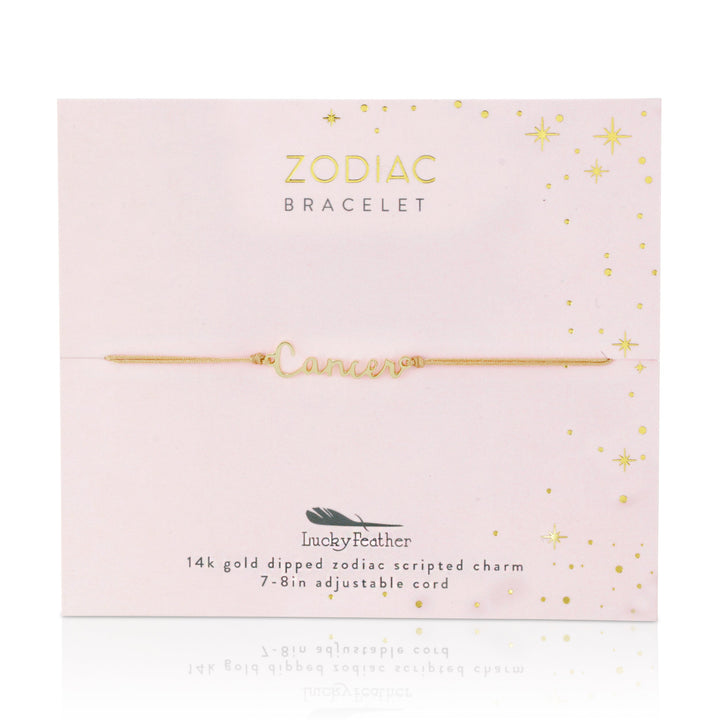 Introducing the Zodiac Bracelet Cancer by LuckyFeather, featuring a delicate adjustable cord with a Cancer zodiac charm, elegantly dipped in 14k gold. It is beautifully packaged with a celestial design and adorned with gold stars alongside the Lucky Feather logo—ideal for those who treasure zodiac bracelets infused with luxury.