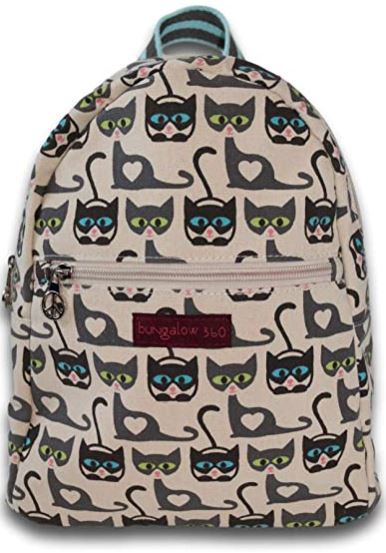 Introducing the Bungalow 360 Backpack Cat: a beige backpack crafted from natural cotton canvas. It showcases a charming pattern of gray cats with green and blue eyes, each sporting a heart-shaped nose. The design is further enhanced by the cats' tails curling into heart shapes. The backpack includes a front zipper pocket and proudly displays the "Bungalow 360" logo tag, renowned for its distinctive designs.