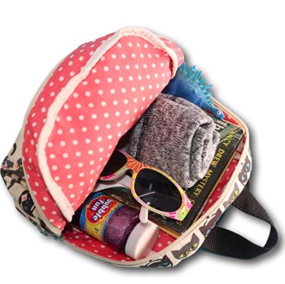 Open the Mini Back Pack Cat by Bungalow 360 with its pink polka-dot lid and zipper closure. Inside you'll find folded gray clothes, a blue stuffed animal, a book, colorful sunglasses, a jar of purple glitter slime, and a small white bottle. Made of cotton canvas with an adjustable strap and black handle, this backpack's charming patterned outer fabric makes it extra delightful.