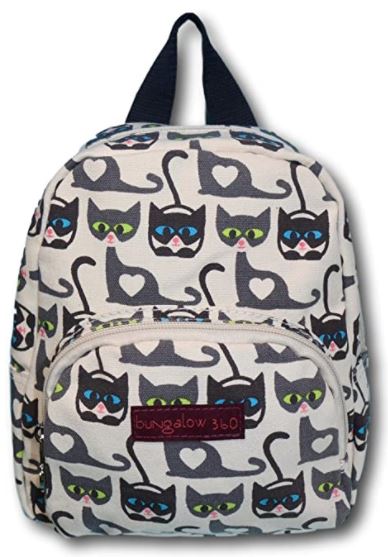 The Mini Back Pack Cat by Bungalow 360 is adorned with a playful black cat pattern on a light cotton canvas background. The design features cats with heart shapes on their chests and vibrant eyes in pink, green, and blue. It has a zipper closure, adjustable straps, and a front pocket displaying the Bungalow 360 brand name on a maroon label.