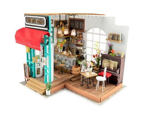 The Simons Coffee DIY Miniature Kit by Hands Craft showcases an intricate 3D dollhouse puzzle depicting a charming café with a red awning. Inside, you'll discover a cozy setting complete with a small counter, hanging lights, tables and chairs, a piano, and decorative plants. The sign proudly displays "Simon’s Coffee," enhancing the vibrant and inviting atmosphere of the detailed interior.