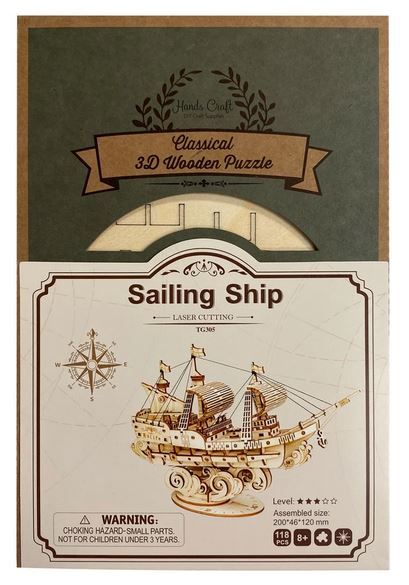 A box for the "DIY Sailing Ship" by Hands Craft, featuring a sailing ship design. Created from non-toxic wood, the box is mostly green and beige with intricate detailing. The puzzle name and branding are visible alongside an illustration of the assembled sailing ship on the front—an ideal educational project.