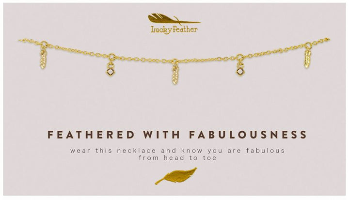 A 14k gold-plated Dangle Necklace Feather by LuckyFeather, featuring adjustable feather charms and set against a white background. The text reads: "FEATHERED WITH FABULOUSNESS - wear this necklace and know you are fabulous from head to toe." A feather logo is displayed at the top.