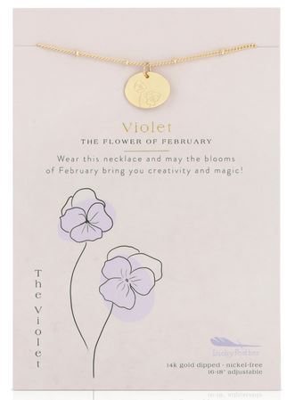 The LuckyFeather Birth Flower February Violet necklace showcases a 14k gold-dipped circular pendant with an elegant flower engraving. Presented on a personalized card, it reads: "Violet, the flower of February. Wear this necklace and may the blooms of February bring you creativity and magic!" The card is beautifully adorned with flower illustrations.