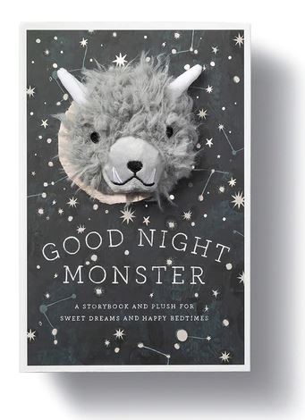 Introducing the "Goodnight Monster Gift Set" by Compendium: A book cover showcases a charming plush monster emerging from a starry, constellation-filled background. The title, "Goodnight Monster," is followed by the subtext, "A Storybook and Plush for Sweet Dreams and Happy Bedtimes." This delightful plush toy features horns and a friendly face, designed to help children manage their emotions at bedtime.