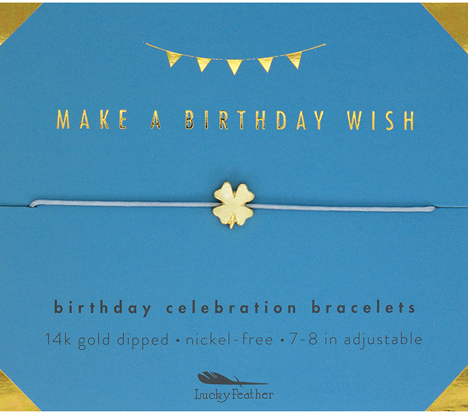 A card with a string bracelet adorned with a clover charm, featuring the message "Make a Birthday Wish." The details include: "Wish Birthday bracelet, 14k gold dipped, nickel-free, 7-8 in adjustable," and it prominently displays the LuckyFeather logo. Ideal for celebrating special occasions.