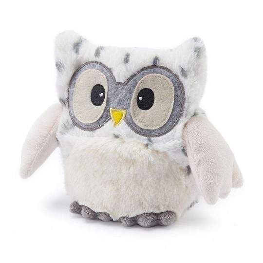 The Snowy Owl Warmie by Warmies is a plush toy with large round eyes and a small yellow beak, resembling an owl. Its fluffy body emits a soothing lavender scent, and its soft wings rest flat on surfaces, perfect for cozy moments when microwave warmable comfort is needed.