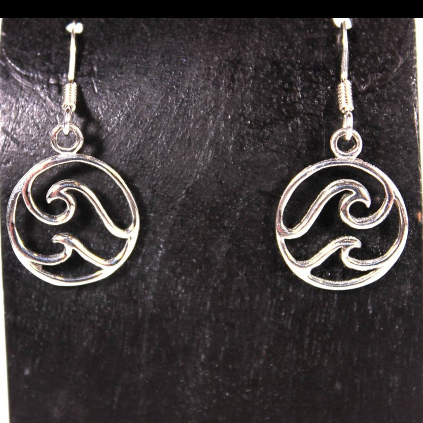 Welman presents the Double Wave Dangle Earring, featuring sterling silver with graceful swirl designs, beautifully highlighted against a black background.