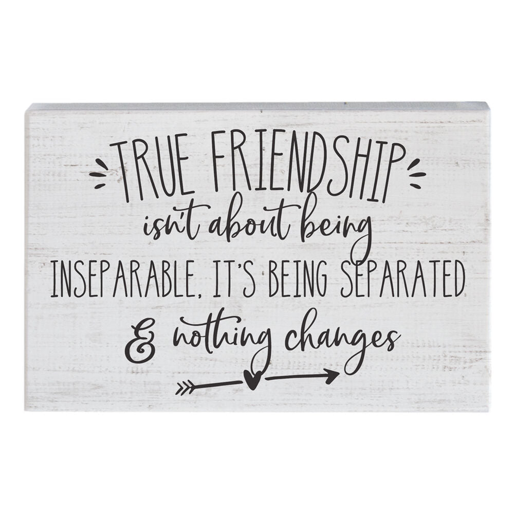 The "True Friendship" sign by SincereSurroundings is a handcrafted wooden piece featuring a whitewashed background and black text that reads, "True friendship isn't about being inseparable, it's being separated & nothing changes." Adorned with two arrows and small heart illustrations, it offers an easy display of heartfelt sentiment.